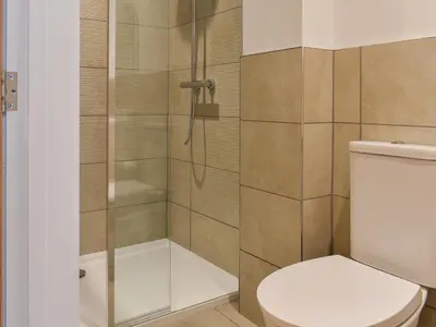 a bathroom with a toilet and a shower at 3 Le Dorney Villa - Uk49820 in Par