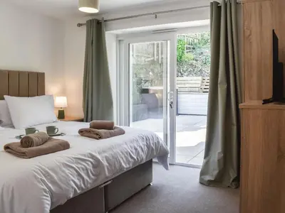 a bedroom with a bed with two towels on it at 3 Le Dorney Villa - Uk49820 in Par