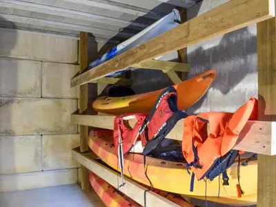a shelf with two kayaks on top at 2 Le Dorney Villa - Uk49804 in Par