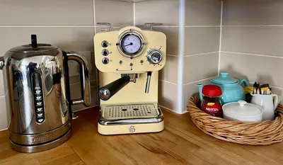 a mixer sitting on a counter next to a basket at Pufflings, Padstow Coastal Cottage, Free Private Parking in Padstow
