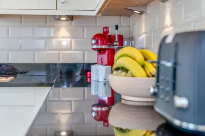 a kitchen with a bowl of bananas on a counter at 5 Bed in Mitchell oc-c30790 in Mitchell