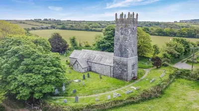 an aerial view of an old building with a tower at 2 Bed in Advent oc-o31790 in Lanteglos