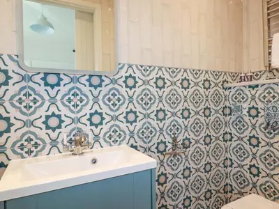 a bathroom with a sink and a mirror at Beach View House in Newquay