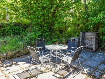 a table and four chairs sitting around a table and chairs at The Stable - Uk49829 in Callington