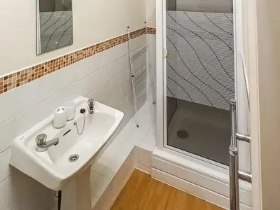 a bathroom with a sink and a shower at The Stable - Uk49829 in Callington