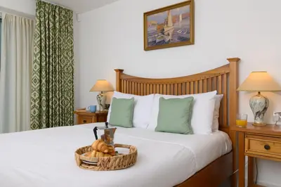 a bedroom with a bed with a basket of pumpkins on it at Luxury Apartment very close to Tolcarne Beach in Newquay