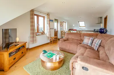 a living room with a couch and a tv at 3 Bed in Marazion oc-m30668 in Marazion