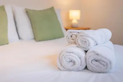 a pile of towels sitting on top of a bed at 3 Bed in Marazion oc-m30668 in Marazion