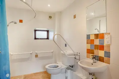 a bathroom with a toilet and a sink at 3 Bed in St. Endellion oc-o30761 in Saint Endellion