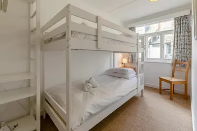 a bedroom with two bunk beds and a window at 2 Bed in St. Ives oc-b31979 in St Ives