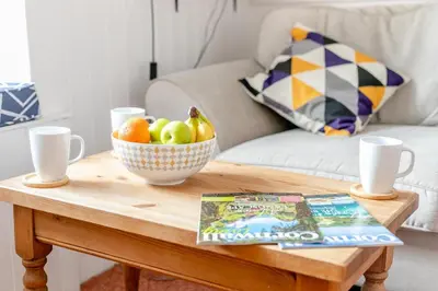 a table with a bowl of fruit and a book at 2 Bed in St. Ives oc-b31979 in St Ives
