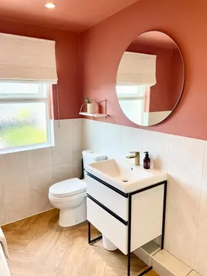 a bathroom with a white toilet and a mirror at North Coast Hideaway in Redruth