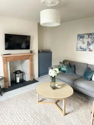 a living room with a couch and a table at North Coast Hideaway in Redruth