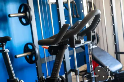 a row of exercise equipment in a gym at Blue Mist Apartment in St Ives