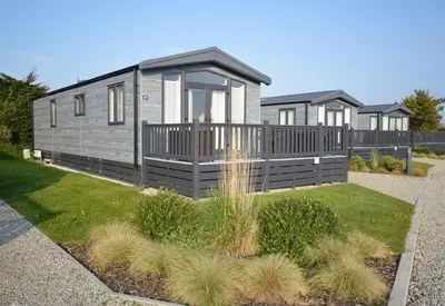 a row of modular homes in a yard at Riverwood Lodge, Padstow in Padstow