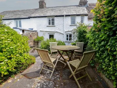 a table and chairs in front of a house at Trevean in Bude