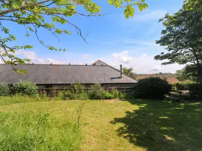 a house in a field with a yard at The Shippen in Penzance