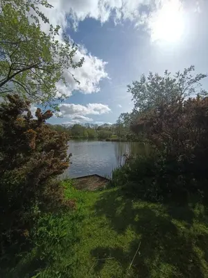 a view of a lake from a yard at The Green - Summer Breeze in Crantock