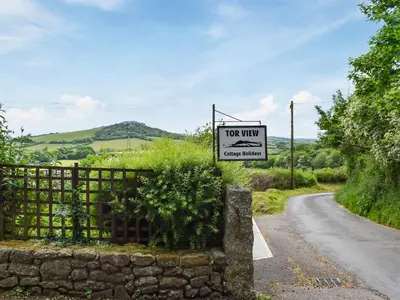 a hot week sign on a fence next to a road at The Old Workshop - Uk49871 in Lanivet