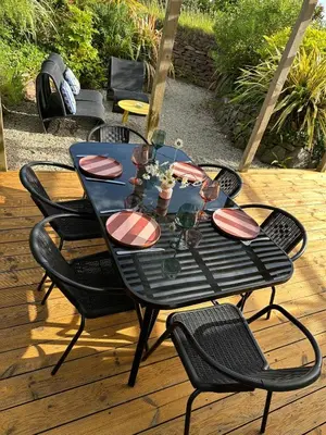 a black table and chairs on a patio at Static Caravan Near Perranporth in Perranporth