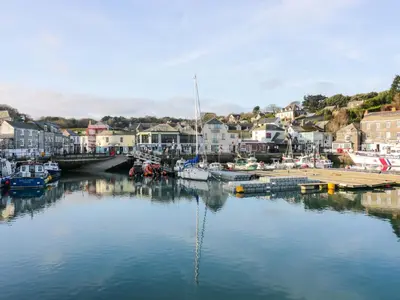 a body of water with boats in a harbor at H2 Atlantic Bay Holiday Park in Padstow