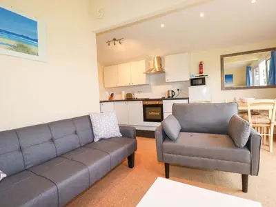 a living room with a couch and a chair at 161 Atlantic Bay Holiday Park in Padstow
