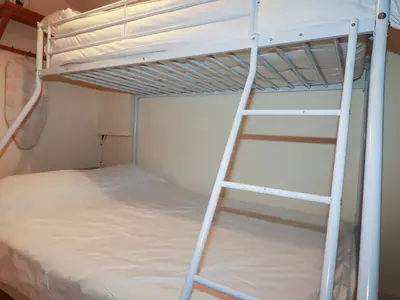 a ladder towered over a bunk bed in a room at 161 Atlantic Bay Holiday Park in Padstow