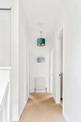 an empty hallway with white walls and a green ceiling at Peaceful - 10-min walk to beach - The White House in Falmouth