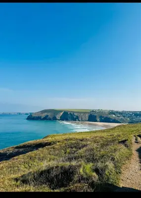 a view of the ocean and a beach at Shepherds Hut in Mawgan Porth