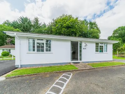 a white house on a street at Chalet The Birches by Interhome in Liskeard