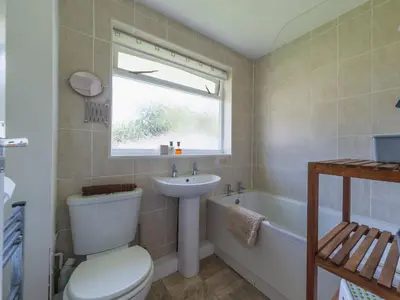 a bathroom with a toilet and a sink and a tub at Chalet Rosecraddoc Lodges by Interhome in Liskeard