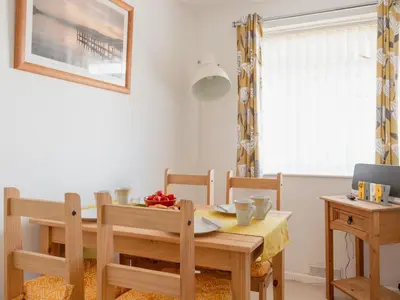 a dining room with a table and chairs at Chalet Bliss by Interhome in Liskeard