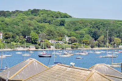 a bunch of boats sitting in the water at Finest Retreats - Williams Court in Falmouth