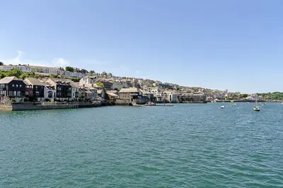 a large body of water with houses and boats at Finest Retreats - Williams Court in Falmouth