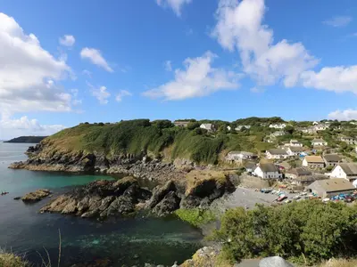 a small village on a rocky island in the ocean at Mermaid Cottage in Helston