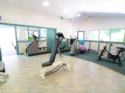 a gym with several treadmills and exercise bikes at Trouts Reach in Falmouth