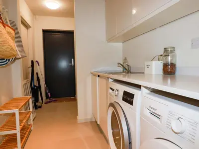 a laundry room with a washer and dryer at 8 Karn Havos in Wadebridge
