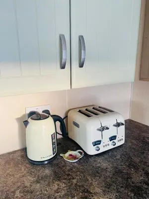two toasters sitting on a counter in a kitchen at Calm View in St Austell