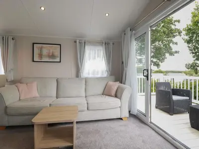a living room with a couch and a table at The Maples, no 56 in St Austell