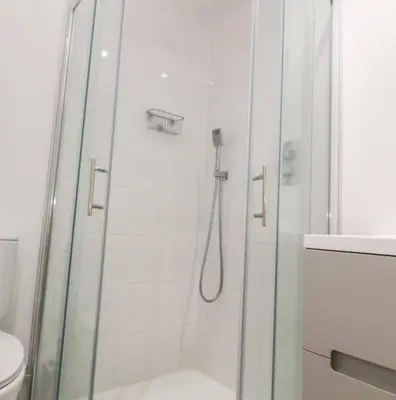 a shower with a glass door in a bathroom at Falmouth Retreat - Family stays in Falmouth