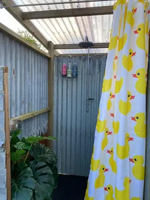 a shower curtain with ducks on it in a backyard at Emilies Bell Tent in St Ives