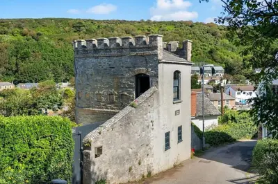 an old building with a door on top of it at Castle by the Beach with Sea Views Portreath in Redruth