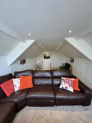 a living room with a brown leather couch at Adorable 3 Bedroom House, Near Newquay 11 Miles in Saint Dennis