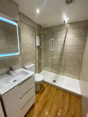 a bathroom with a sink and a toilet and a shower at Lovely 1 bedroom flat in the heart of Newquay in Newquay