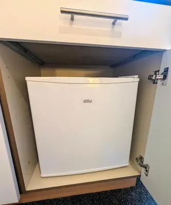 a white refrigerator in a room at Parkside Lodge Manor in Camelford