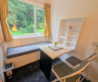 a small room with a desk and a window at Parkside Lodge Manor in Camelford