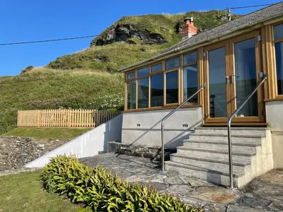 a house on the side of a hill at Sea Ledge in Tintagel