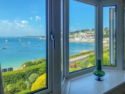 a window with a view of the ocean at Lantreath in Saint Mawes