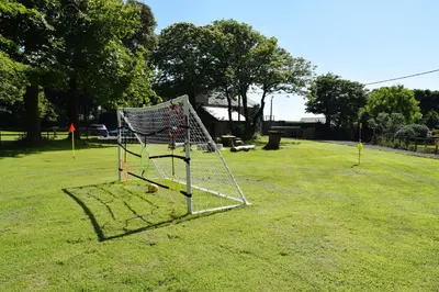 a batting cage in the middle of a park at La Casita in Breage
