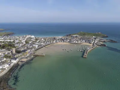 an aerial view of a beach with buildings and the ocean at Charming Cottage by the Sea, Wi-Fi, Pets in St Ives